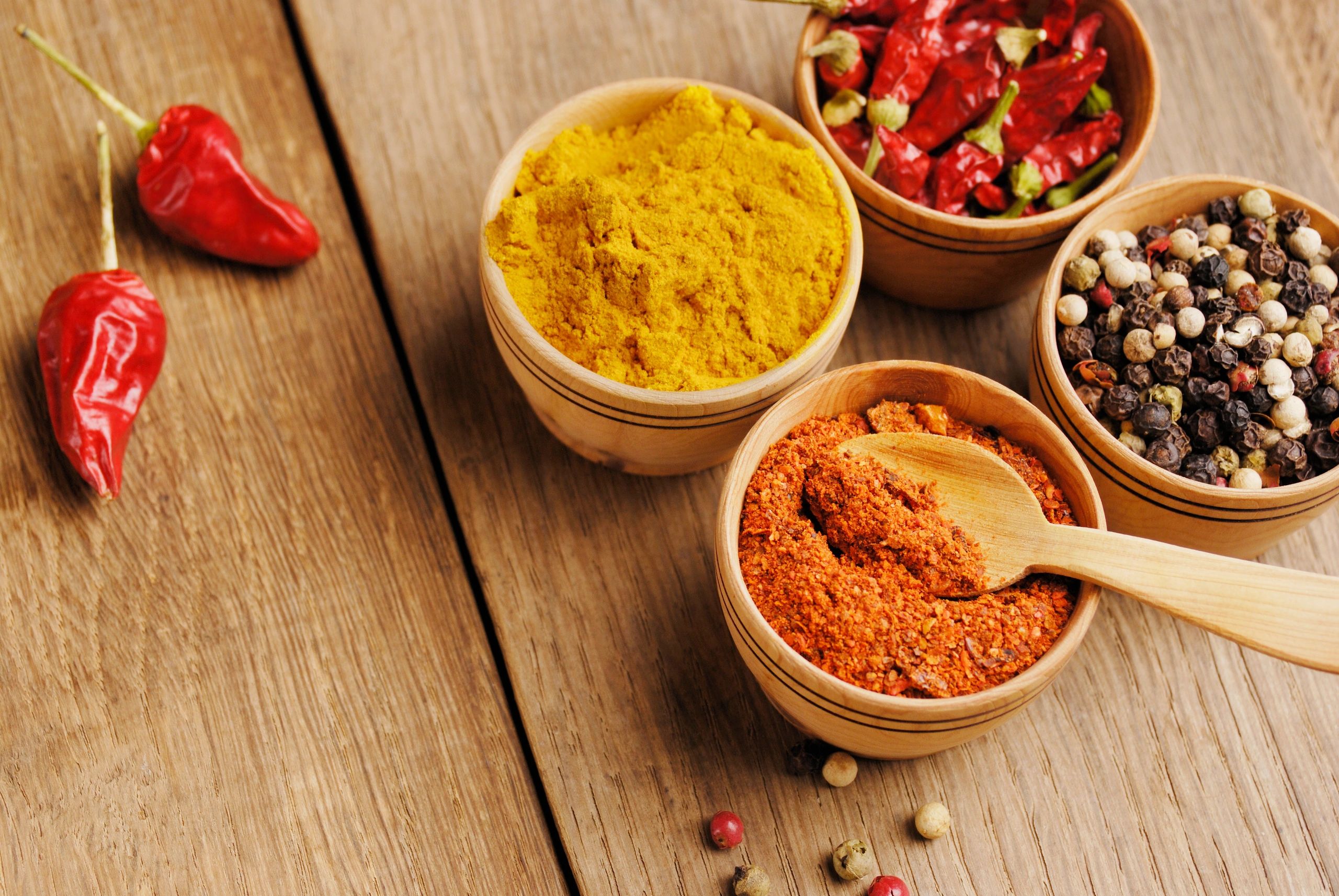Colorful spices and seasonings displayed in bowls
