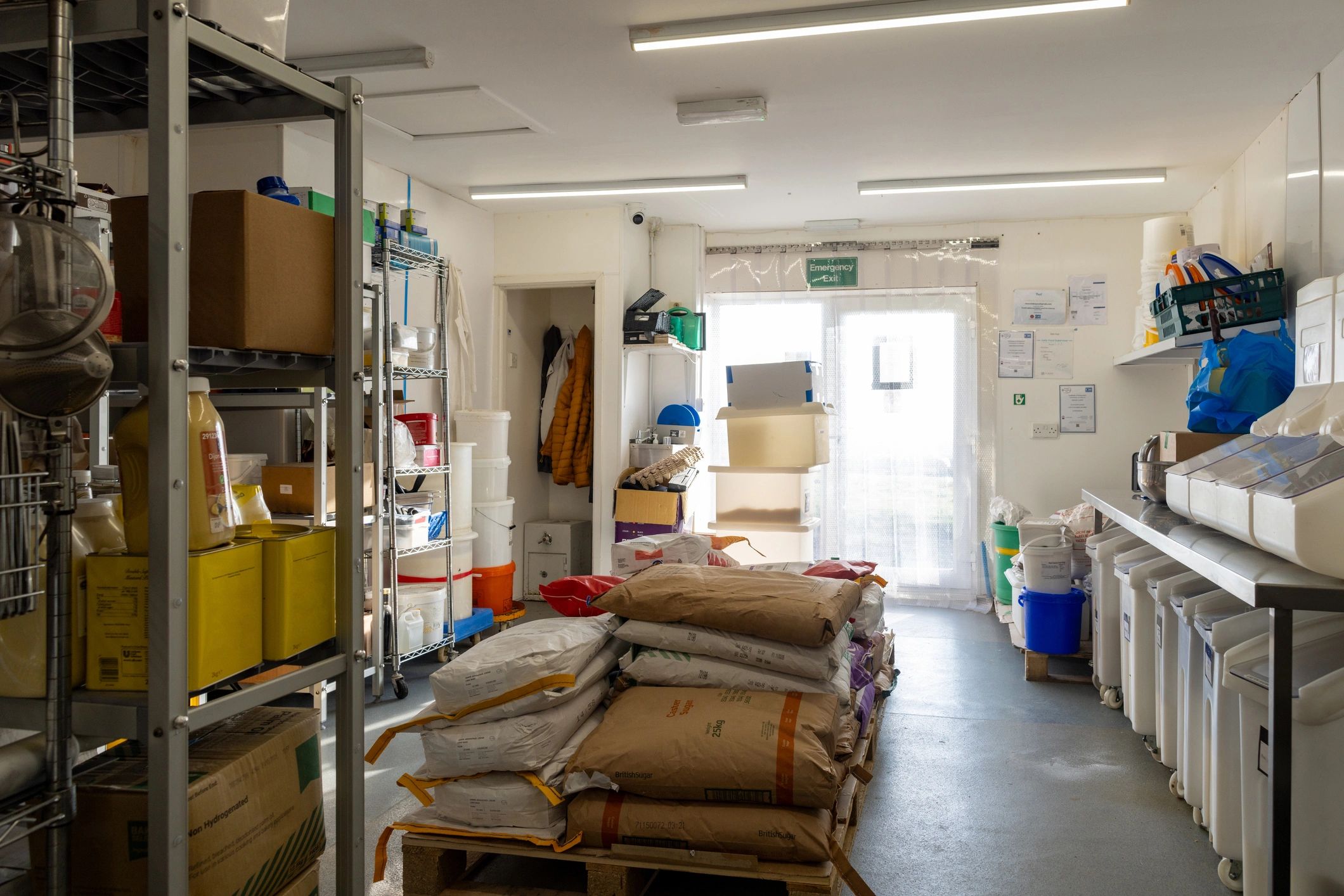 Wholesale pulses and spices inventory stored in organized sacks for B2B dispatch