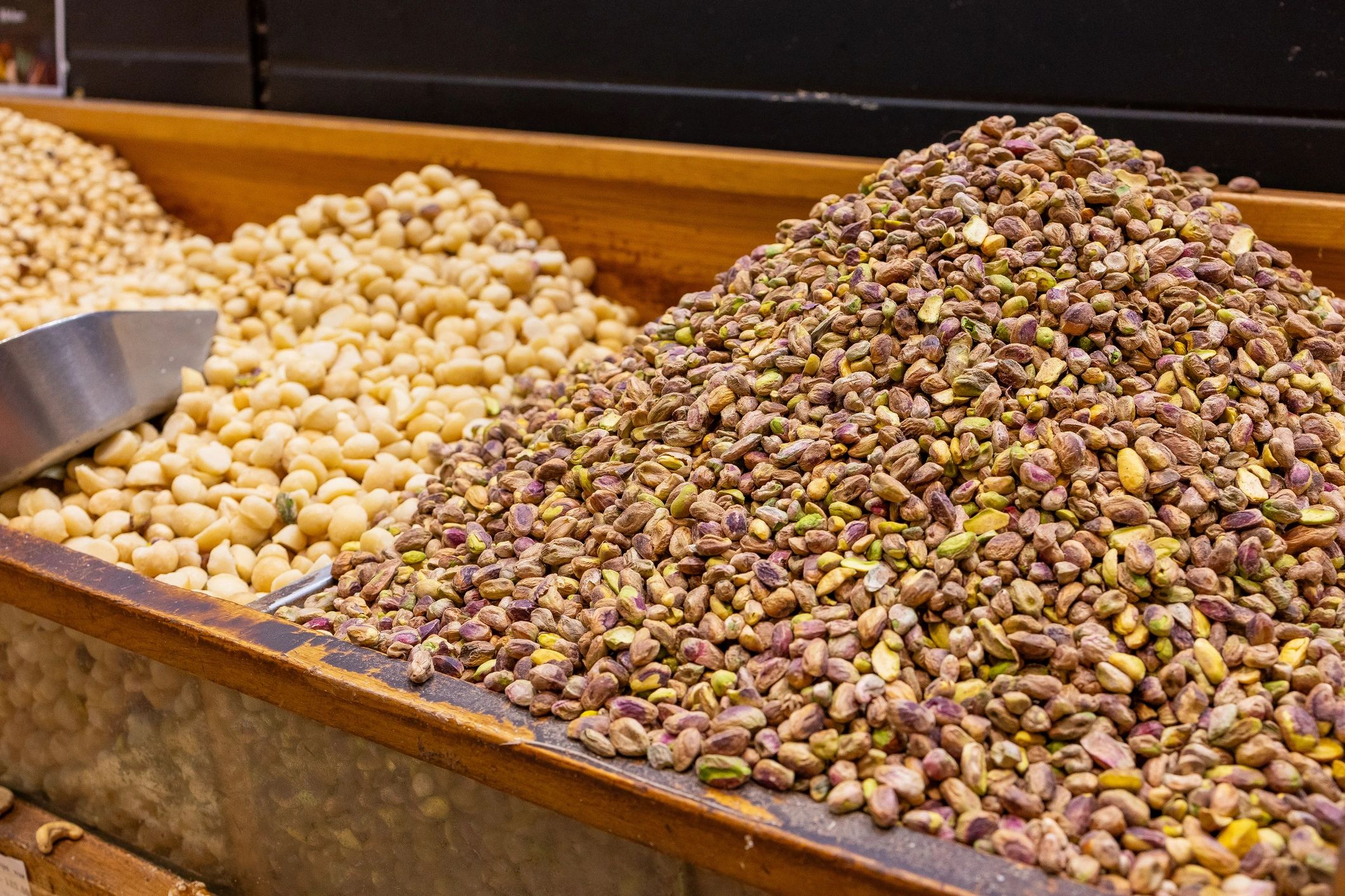 Bulk almonds and assorted dry fruits displayed for wholesale sourcing