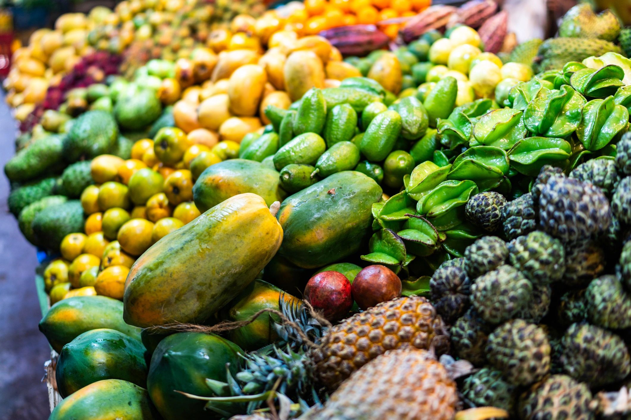 Large display of tropical fruits showing wholesale volume and variety