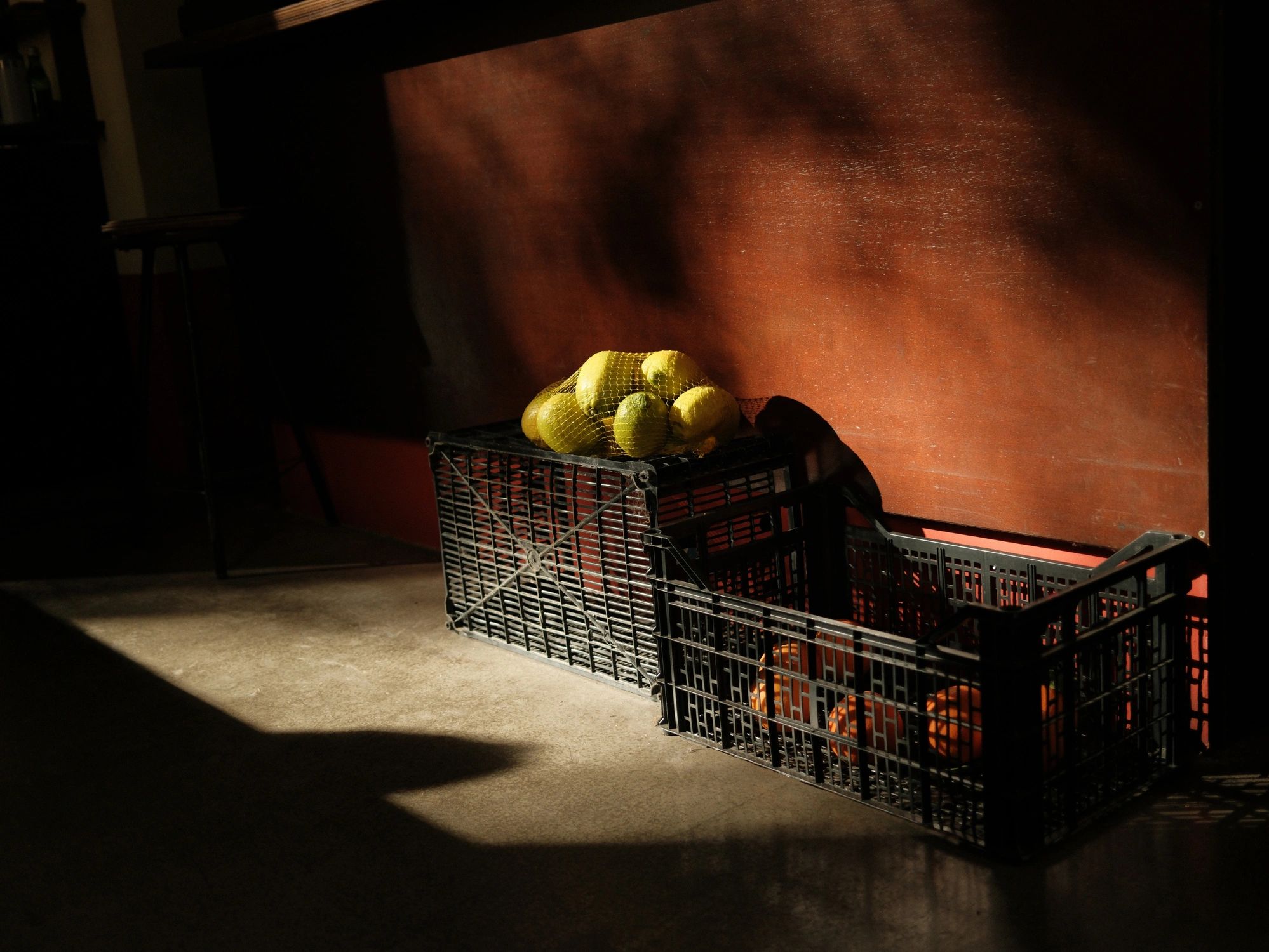 Crates of lemons and oranges for bulk fruit distribution
