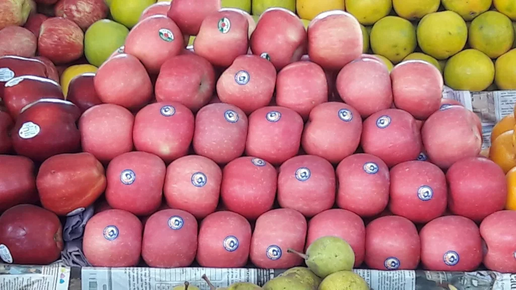 Apples packed in crates at an Indian wholesale fruit market